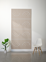 Tan felt sheet with white engraved geometric pattern of vertical lines and curved U-shapes arranged in a grid.