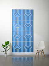 Blue felt sheet with layered white engraved lines in geometric arch and vertical stripe pattern, displayed in four rectangula