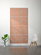 Terracotta felt sheet with white engraved geometric arcs and vertical lines in repeating pattern.
