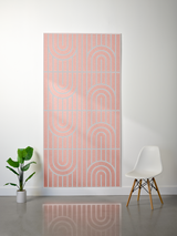 Coral felt sheet with engraved geometric pattern of vertical lines and semicircles arranged in a grid layout.