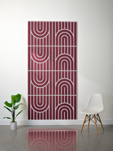 Burgundy felt sheet with engraved geometric pattern of vertical lines and concentric arches in light relief.
