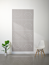 Beige felt sheet with engraved geometric arch and vertical line pattern in repeating rows.