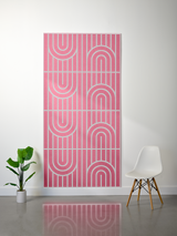 Pink felt sheet with engraved geometric arch and vertical line patterns in four sections.
