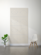 Cream felt sheet with engraved geometric pattern of vertical lines and concentric arches arranged in repeating sections.