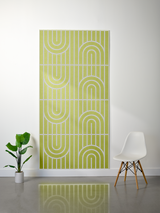 Lime green felt sheet with white engraved geometric pattern of vertical lines and curved arch shapes in four repeating sectio