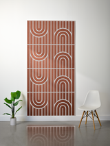 Terracotta felt sheet with white engraved geometric arc and line pattern in four repeated sections.