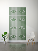 Green felt sheet with white engraved vertical lines and geometric arch patterns in four repeated sections.