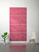 Pink felt sheet with layered white engraved geometric arches and vertical stripe pattern in four repeating sections.