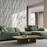 Modern living room with green couch and acoustic accent wall