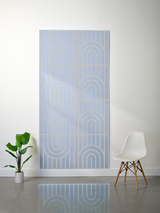 Light blue felt sheet with engraved geometric arch and vertical line patterns in repeating rows.