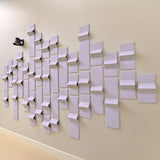 Light purple felt tiles on a wall with peak points to help with acoustics