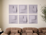 Set of six lavender tiles with three-dimensional geometric cutouts and raised squares arranged in a grid on a wall.