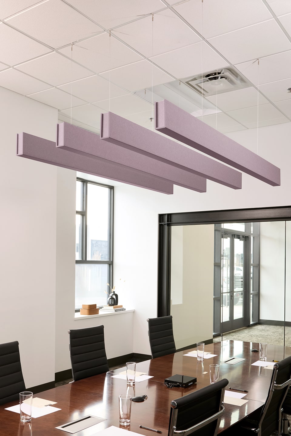 PET felt suspended acoustic beam in Lilac by Felt Right absorbs unwanted noise and looks great in any setting. Available in four or eight foot lengths. Clips into ACT grid or drills into drywall ceiling.