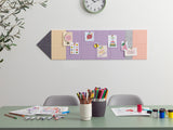 Children's art supplies on a table with a colorful magnetic board on the wall.