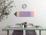 Colorful wall art above a desk with stationery items in a room.