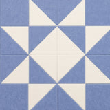 Pattern of blue and white triangles on a blue background