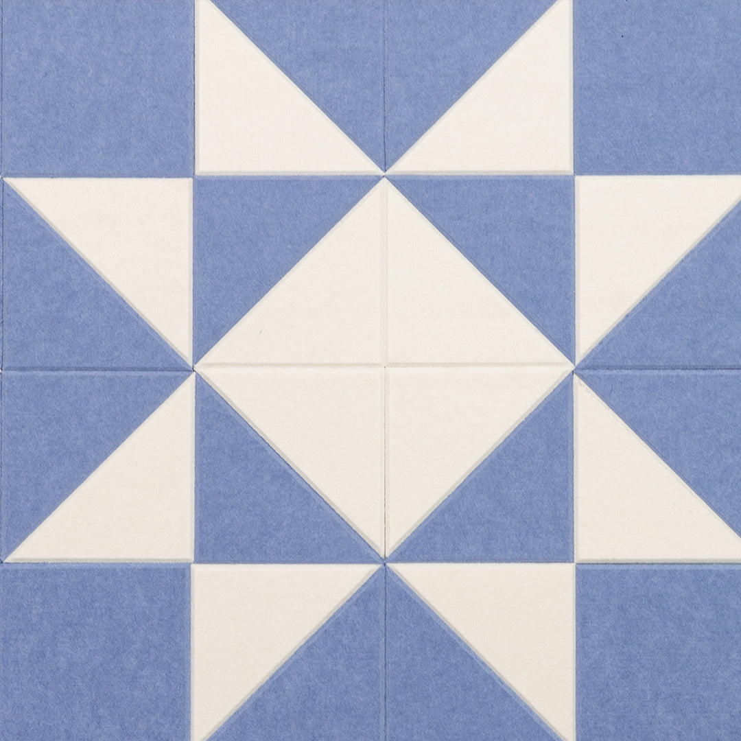 Pattern of blue and white triangles on a blue background