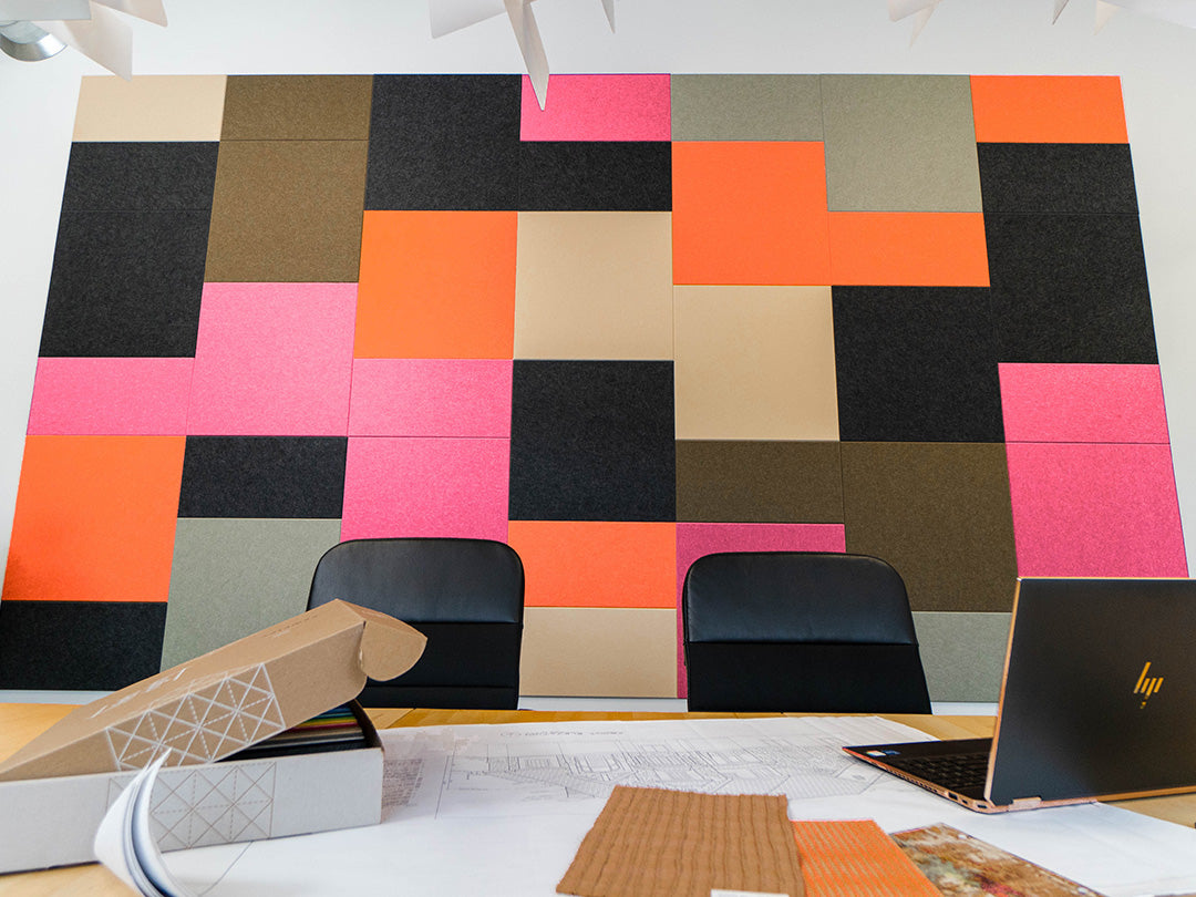 Colorful geometric wall paneling in an office.