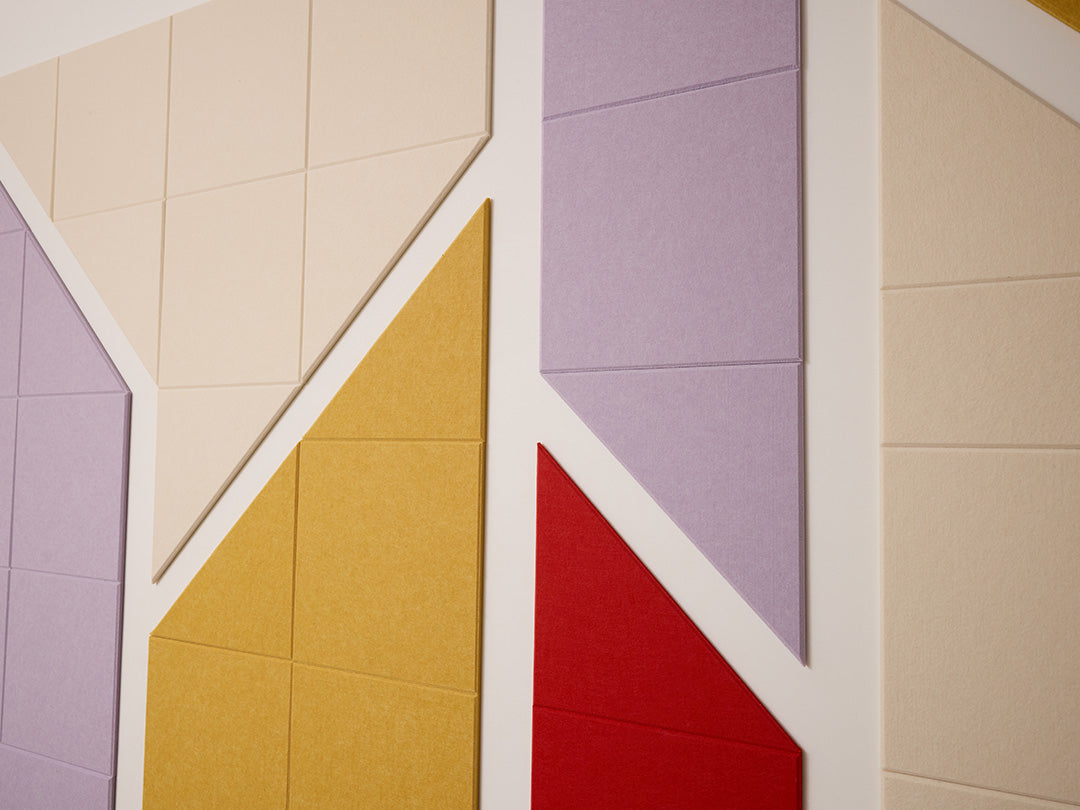 Geometric pattern with colorful tiles in beige, purple, yellow, and red.