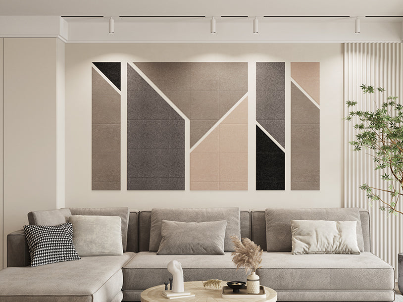 A Felt Right Wall Desgin in a Modern living room with a gray sectional sofa and abstract wall art in neutral shades (cream, grey, black)