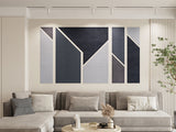 A Felt Right Wall Art Design in a Modern living room with a gray sectional sofa and abstract wall art in different shades of gray