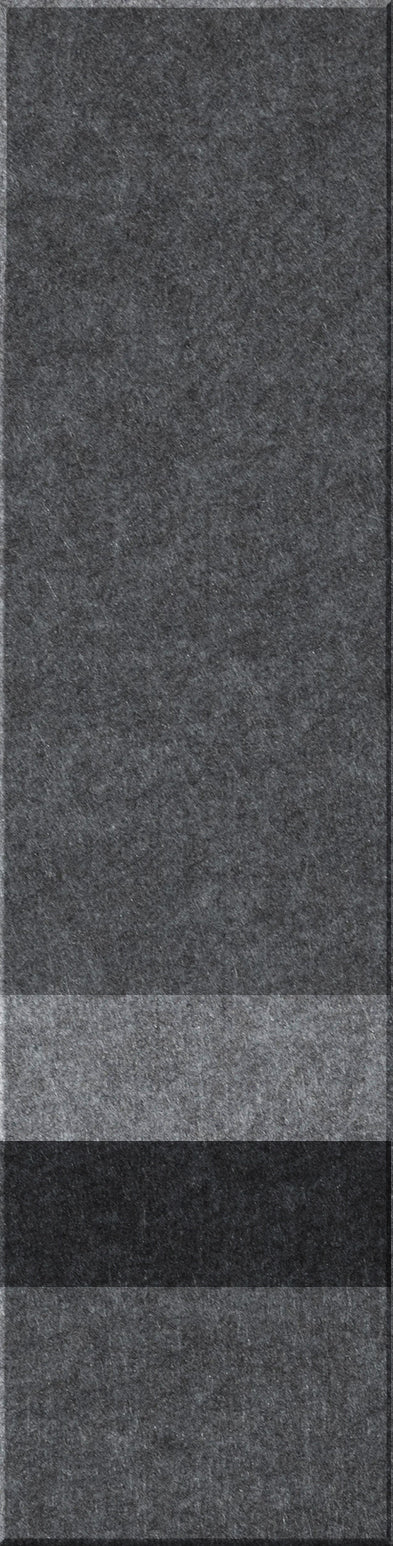 A felt tile that is dark gray on the top, lighter gray, black, and then a dark gray bottom. 