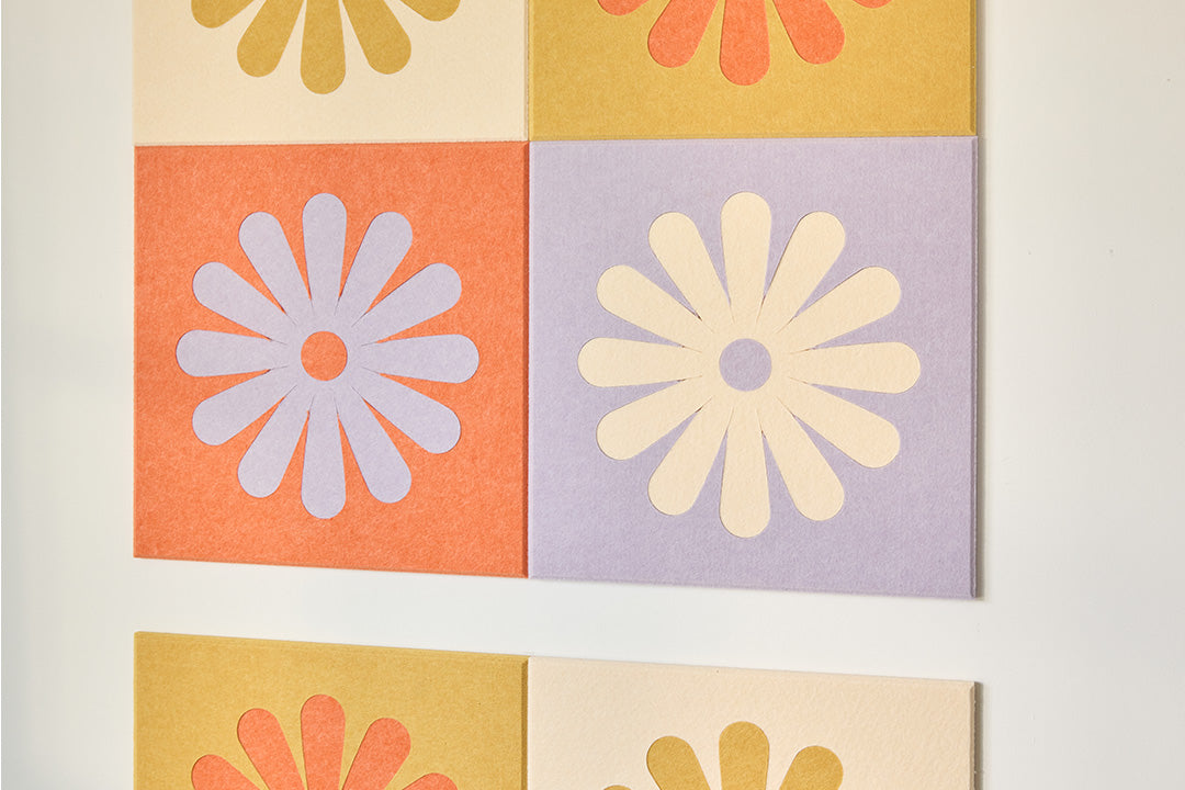 Colorful Flower Tiles Installed on Wall Behind Couch.