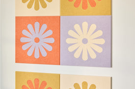Colorful Flower Tiles Installed on Wall Behind Couch.