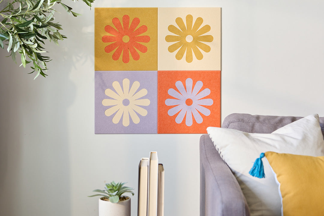 Colorful Flower Tiles Installed on Wall Behind Couch.