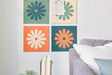 Colorful Flower Tiles Installed on Wall Behind Couch.