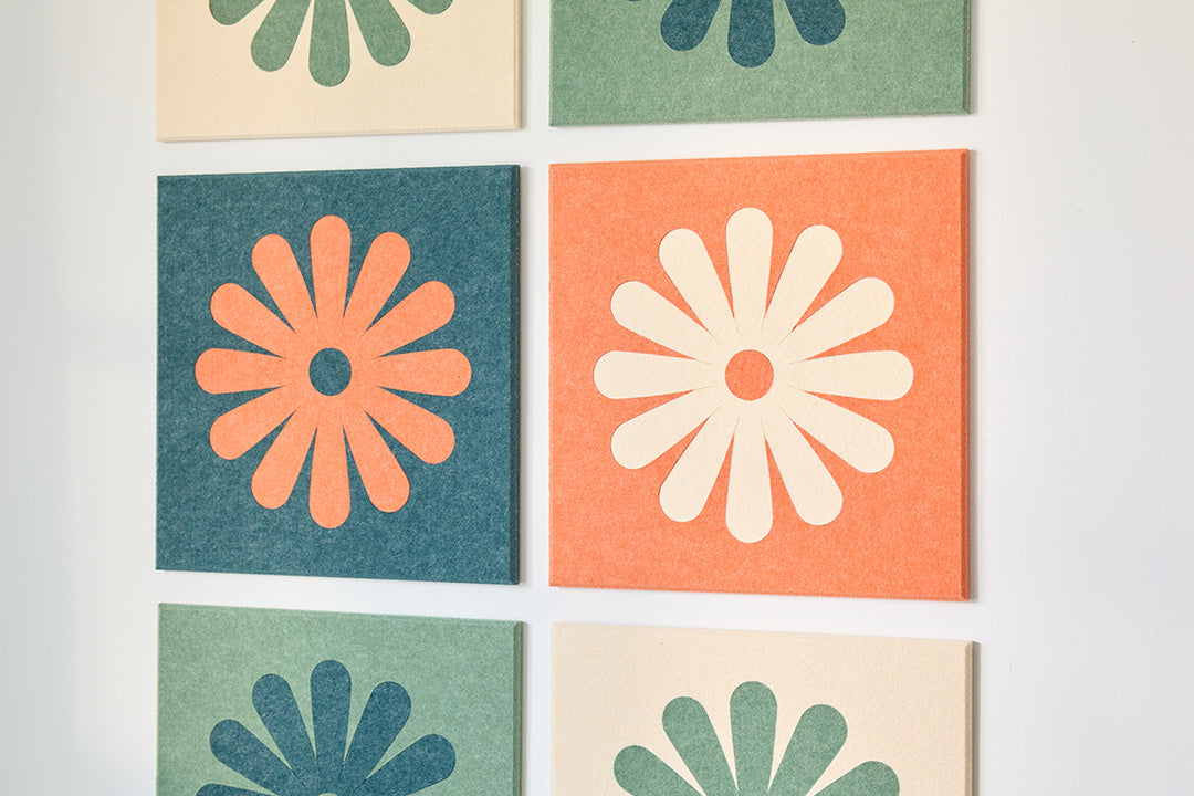 Colorful Flower Tiles Installed on Wall Behind Couch.