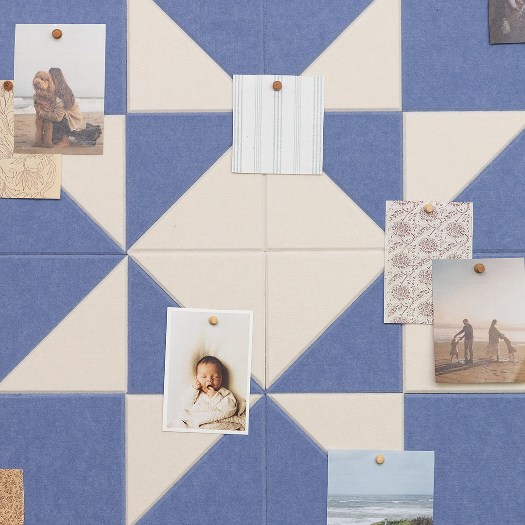 Blue and beige checkered board with pinned photos and notes