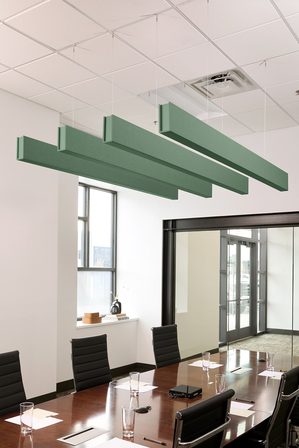 PET felt suspended acoustic beam in Mint by Felt Right absorbs unwanted noise and looks great in any setting. Available in four or eight foot lengths. Clips into ACT grid or drills into drywall ceiling.