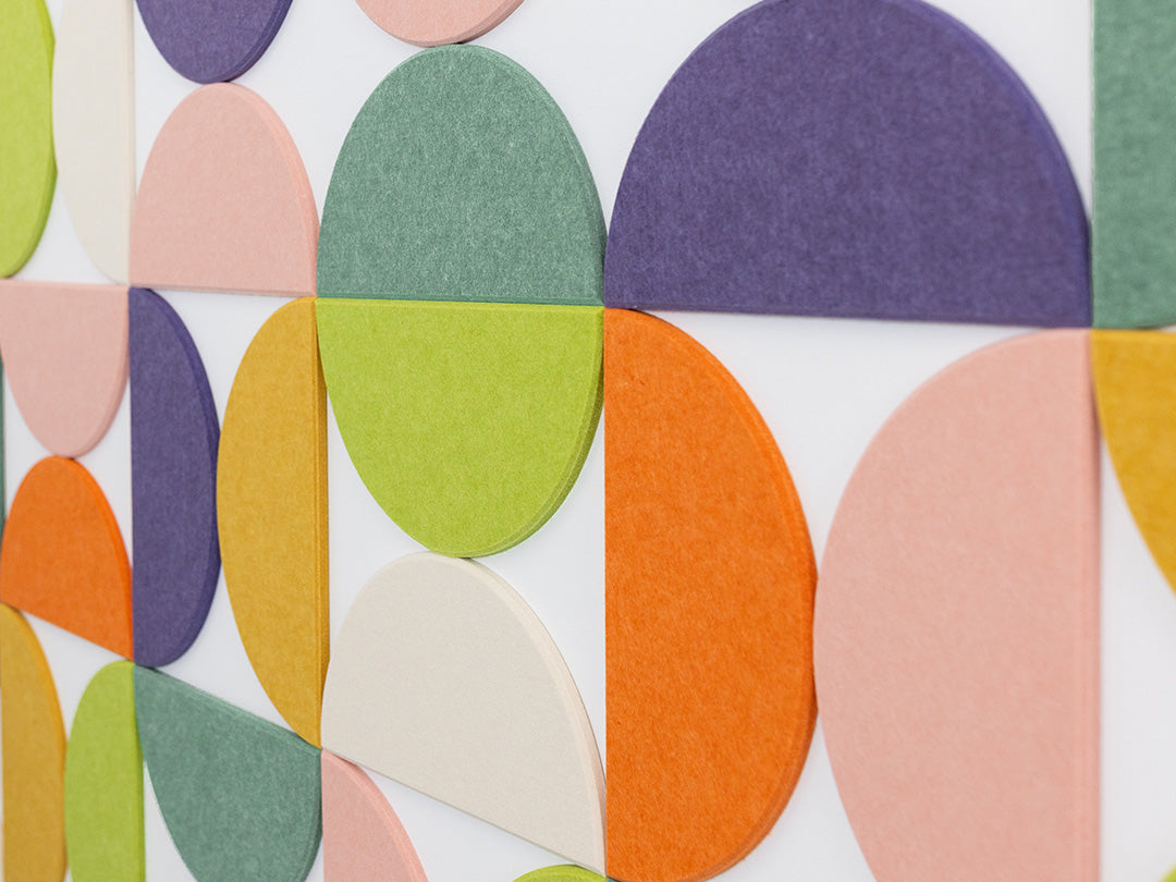 A Felt Right Wall Design using half circles in colorful geometric patterned wall decor.