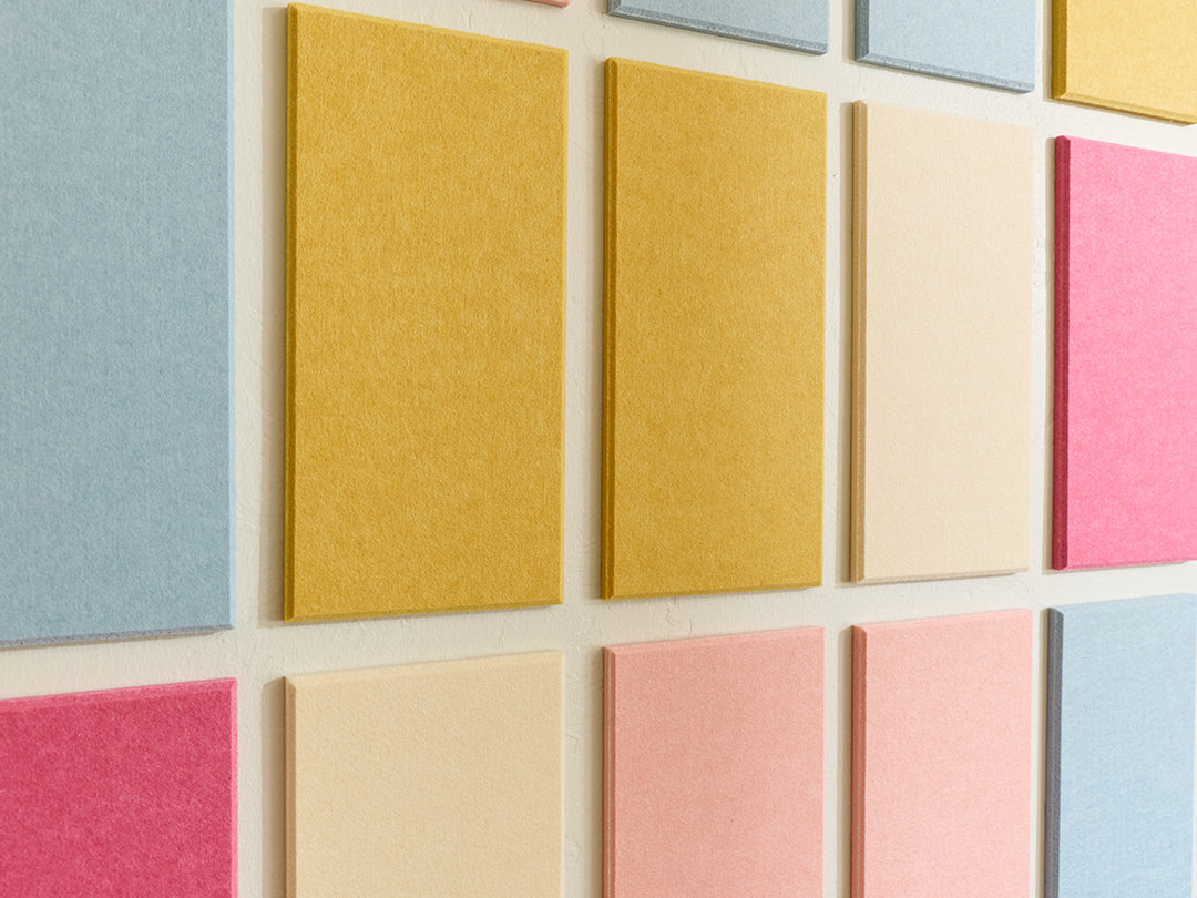 Colorful square tiles arranged in a grid on a light background