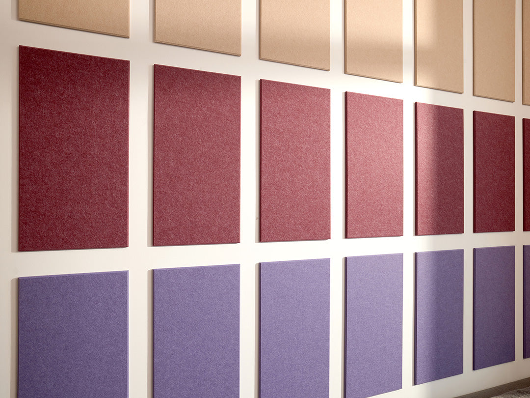 A Felt Right wall art design using rectangles to form a pattern in shades of purple and cream on a white wall.
