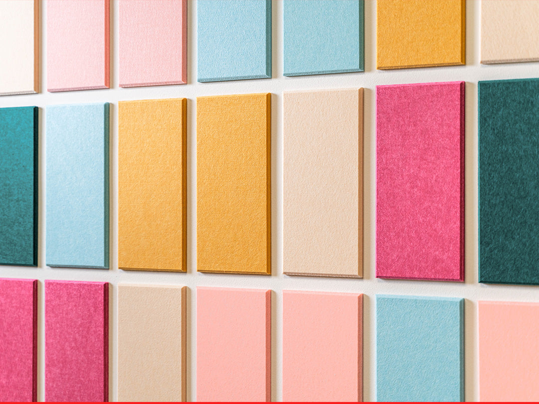 Grid of colorful square tiles on a textured surface