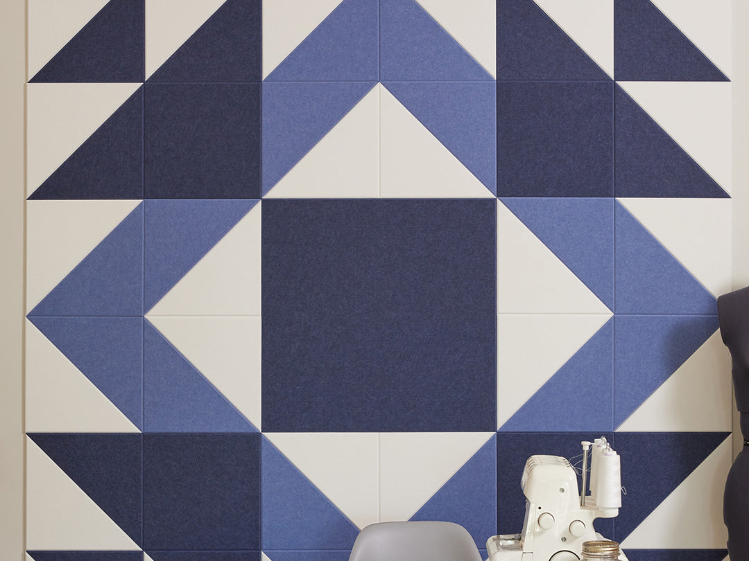Geometric patterned wall tiles with blue and white colors.