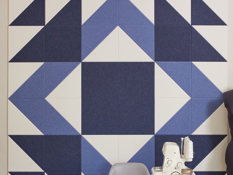 Geometric patterned wall tiles with blue and white colors.