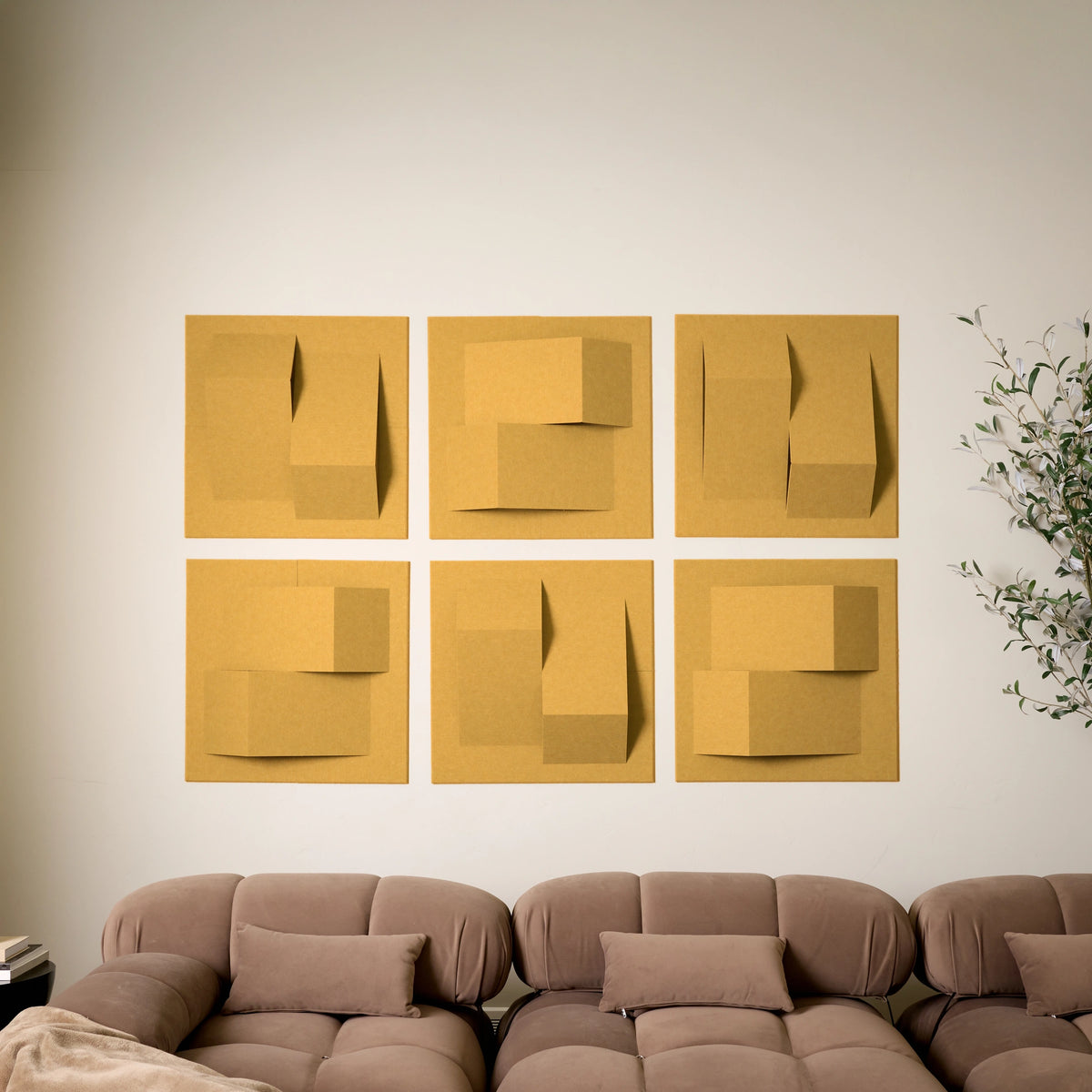 Modern dark yellow acoustic felt wall tiles creating geometric wall art in a living room 