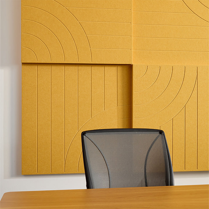 yellow acoustic boxes on wall with organic engraving