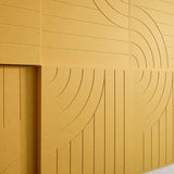 close up shot of yellow acoustic boxes on wall with organic engraving