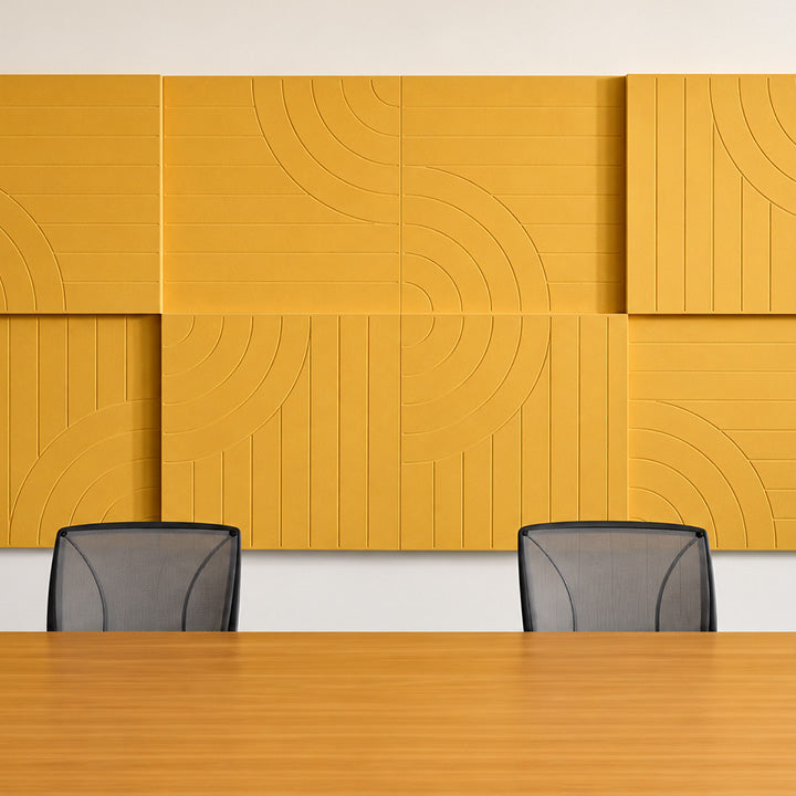 Office with yellow acoustic wall paneling on wall
