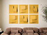 Six yellow dimensional tiles with geometric cutouts and layered surfaces arranged in a grid above a beige sofa.