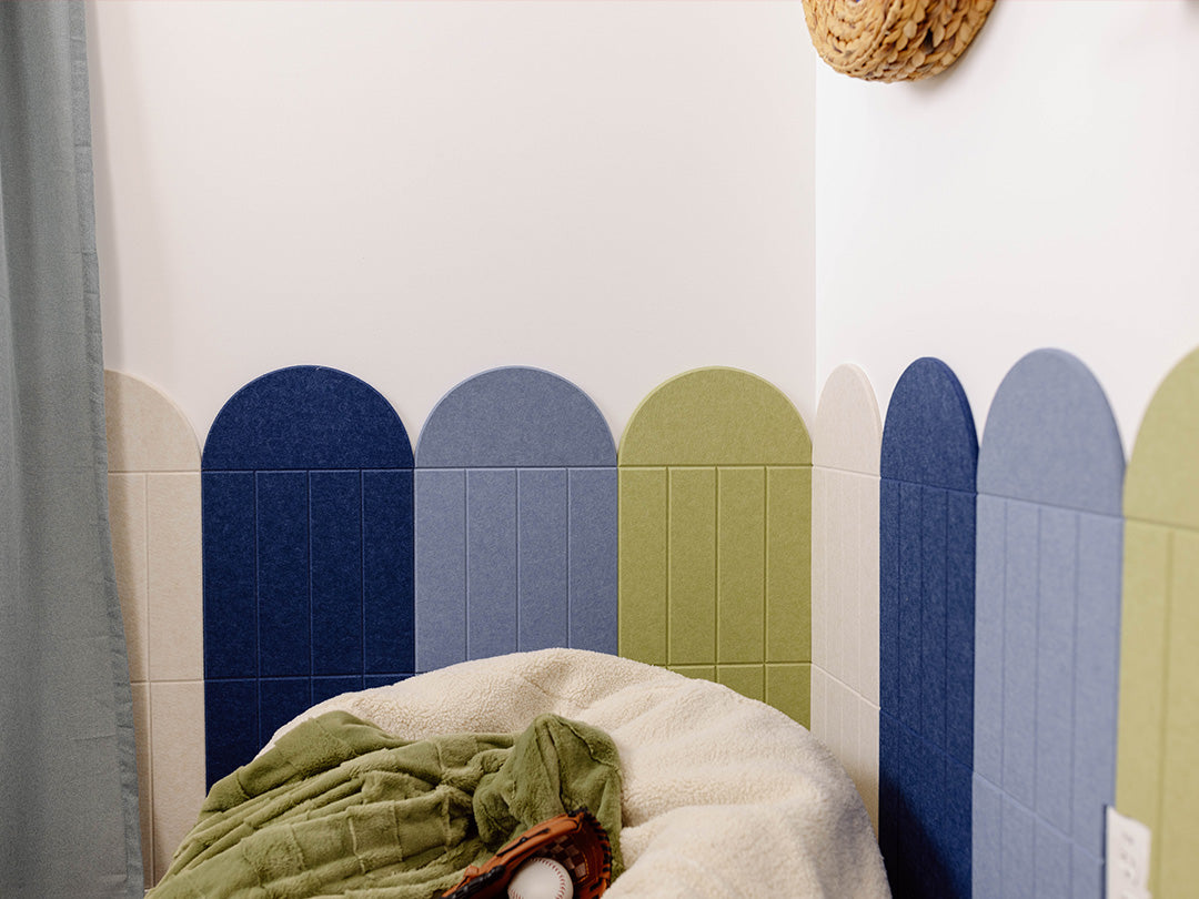 Children's room with a bean bag, plush toys, and colorful wall design.