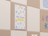 Poster with 'Mrs. Taylor's Classroom' on a tiled wall with decorative flowers.