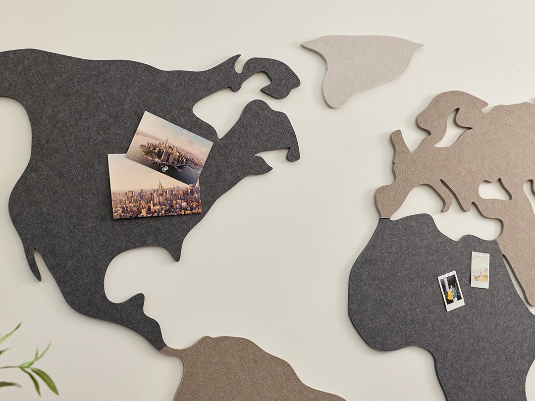 Neutral world map wall art in entryway