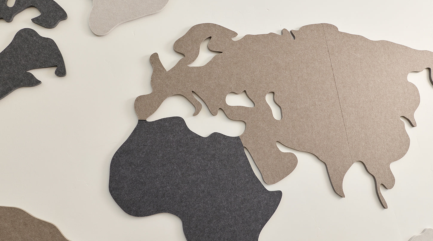 close up of felt world map on wall
