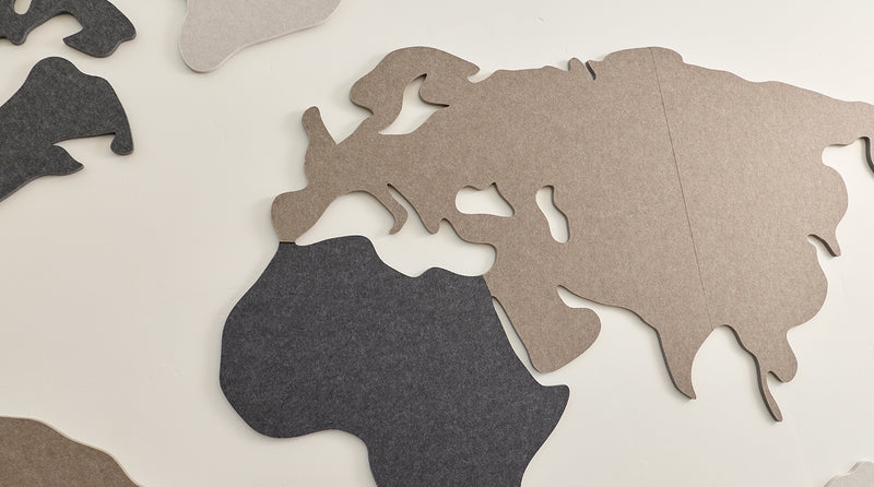 close up of felt world map on wall