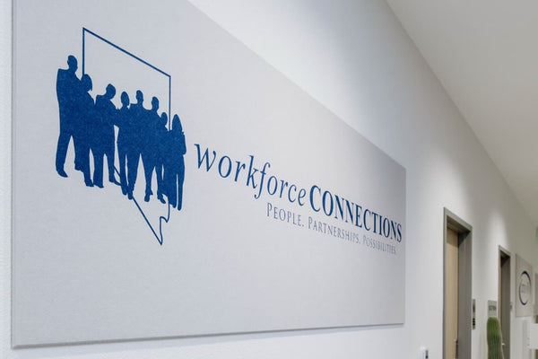 Nevada Workforce Connections logo using blue ink printed on off-white felt